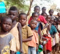 Central African Republic, Bangui, refugee camp at the Convent "Notre Dame du Mont Carmel" of the Carmelite Fathers. Refugee children queuing up for a meal.